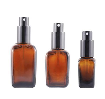 China Spray Amber Glass Bottle Chemical Shade Perfume Bottle 50ml Square Lotion Pump Bottle for sale