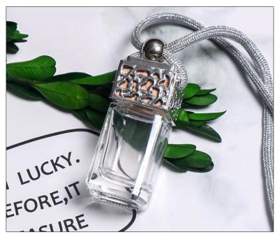 China Cosmetic transparent decoration botella de exquis vidrio and car perfume bottle arming rope glass bottle accept customization mumu for sale