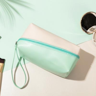 China 2021 Unique Waterproof PU Makeup Bags Women Make Up Bags Customized LOGO Cosmetic Bags for sale