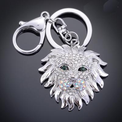 China Best of metal lion keychains selling flat creative rhinestone silver metal fashion lion animal keychains for sale