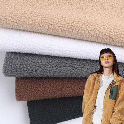 China High Quality Anti-Static Warm Polyester 100% Small Grain Plain Sherpa Shear Knitted Fabric For Coats Sportswear for sale