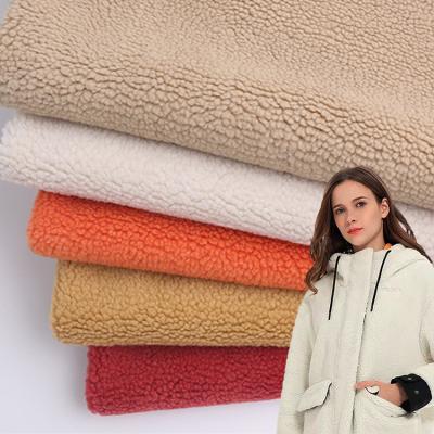 China Antistatic 100% Polyester 3D Hollow Grain Small Sherpa Fleece Knitted Fabric For Coat Blanket Toys for sale