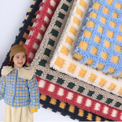 China Multi-patterned 100% polyester sherpa plaid multi-patterned jacquard knitted fleece fabric for winter coats for sale