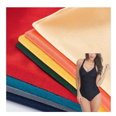 China New bright wind proof polyester spandex fabric knitted stretch polyester spandex breathable fabric for swimsuit fabric for sale