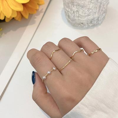 China Cute Simple Sc Jewelry Gold Plated Wave Gold Ring Korean 5psc Pearl Ring Set For Women 2021 for sale