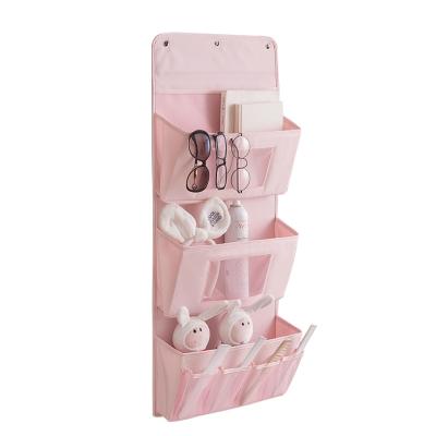 China Sustainable Foldable Home Storage Bags 3 Hanging Storage Bag Pockets Over The DoorMultifunctional Fabric Storage Bag for sale