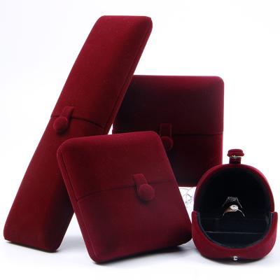 China Promotion Velvet Recyclable Jewelry Box For Ring Bracelet Necklace Earrings Big Brand Red Button Design Jewelry Set Box for sale