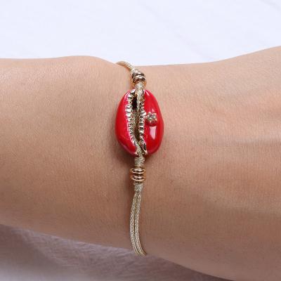 China Fashionable Red Natural Shell Elastic Women Bracelet Beach Bracelet Jewelry Gold Plating Sea Cord Making for sale