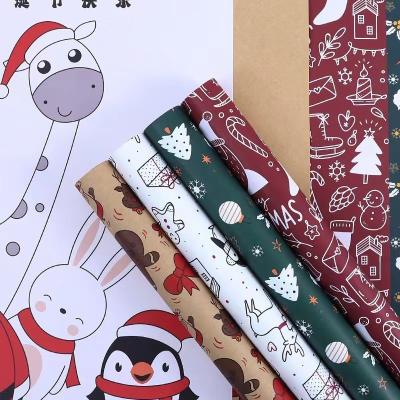 China Papel de envoltorio para regalos de la Feliz Navidad los 58cm los x hojas documentos impresas 58cm de Kraft 20 en bolso en venta