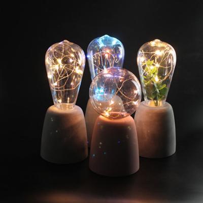 China Modern three-dimensional narrow columns cement light with plastic bulb for sale