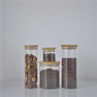 China Latest Cover Food Storage Jar 750Ml Round Glass Bottle With Cork Ergo Glass Jar Mini Favor Glass Jars for sale