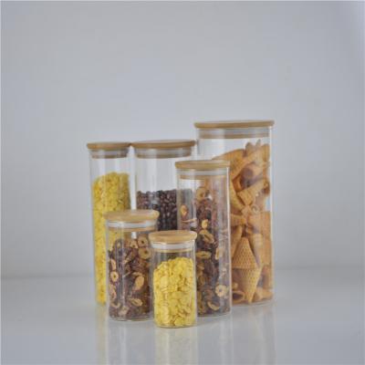 China Ebay Hot Sale Cover Jar Glass Storage Jar Wide Mouth Bottle With Cork Cover Jar Glass Storage Candle Jars And Lids for sale