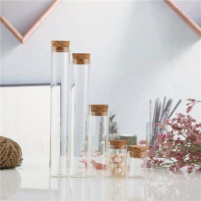 China Hot Selling High Quality Professional Beverage Mini Empty Glass Wishing Bottle Transparent Alumina Covered Glass Bottle for sale