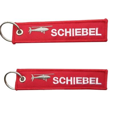 China Promotional Gift Wholesale Customize Souvenir Woven Key Chain Embroidery Logo Fabric Jet Tag Travel Keychain for sale