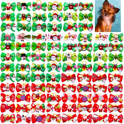 China Sustainable Cute Dog Bows Christmas Santa Yorkshire Dog Bows Hair Puppy Bows With Elastic Bands for sale