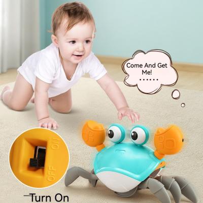 China Baby Motivator Tummy Time Infant Baby Automatic Crawling Crawling Crab Toy With Music And Led Light Up for sale