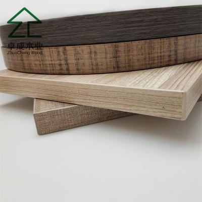 China Wooden color PVC edge banding/edge banding tape for particle board MDF board Melamine plywood for sale