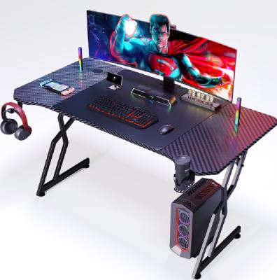 China Ergonomically Designed  Carbon Fiber Computer Desk With 1.2cm Particle Board And Carbon Fiber Cover Featuring Cup And Headset Holders for sale