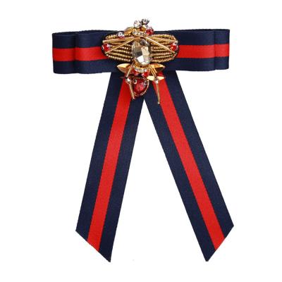 China Fashionable Women Clothing Accessories Pins College Cloth Art Beads Manual Bow Brooch for sale