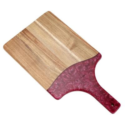 China New Season Sustainable Wood and Resin Chopper Cheese Board Kitchen Ware Epoxy Cutting Board With Art Handle for sale