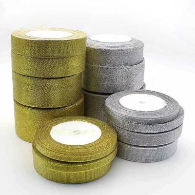 China Wholesale Viable Decorative Trimmings 0.6-5cm Wide Glitter Gold And Silver Ribbons For Gift Wrapping for sale