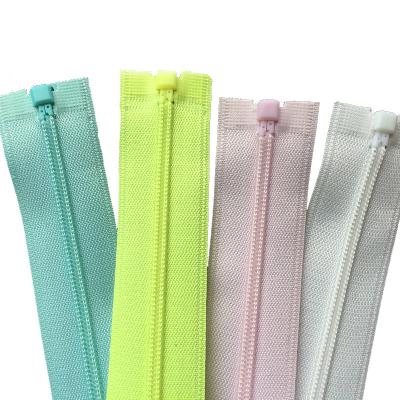 China Eco-friendly Colored Invisible Waterproof Nylon Auto Lock TPU Zipper for sale