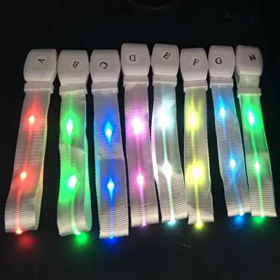 China Wireless Control Light Up Event Glow In The Dark Area Flashing Fabric LED Wristband 8 Remote DMX Control LED Nylon Wristband for sale