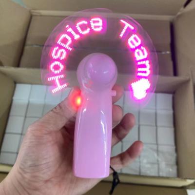 China Pink Mini and Portable Fan Handle Pink Words Custom LED USB Charging Handheld Mini Traveling Portable Fan LED Message Fan for sale