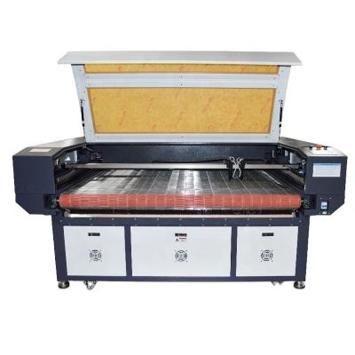 China MT-1610DA Water Cooled Widely Used Cloth And Cloth , Film Laser Cutter 100W CO2 Automatic Feeding Laser Engraving And Cutting Machine Price for sale