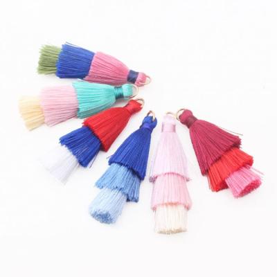 China Custom size newest trend design 3 layers cotton tassels with ring on top for jewelry decoration for sale