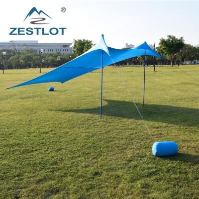 China UV50 UV-Resistant Lycra Sunshade Stretch Sun Beach Tent With Pole Sandbags Anchor for sale