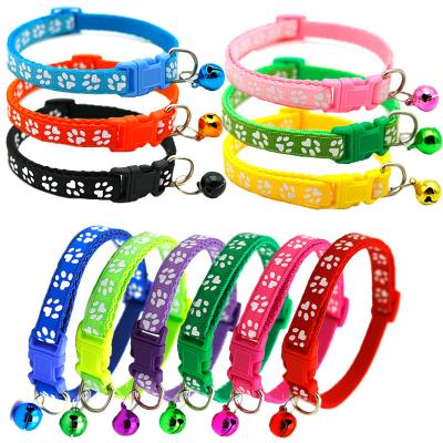 China Small Dog Stocked Cat Collar Buckle Pet Supplies Wholesale Adjustable Nylon Puppy Strap Collar Cat Paw Print Pet Collars With Bell for sale