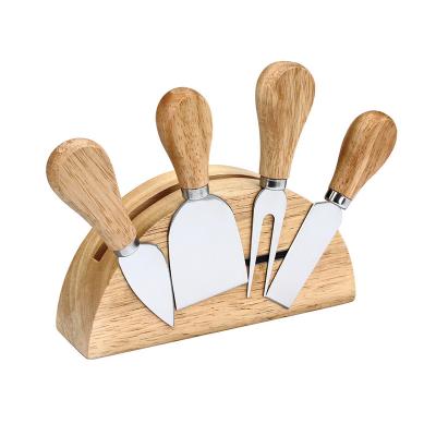 China Sustainable Stainless Steel Cheese Knives 4 Pcs Wooden Handles Cheese Knife Set Board With Magnetic Block for sale