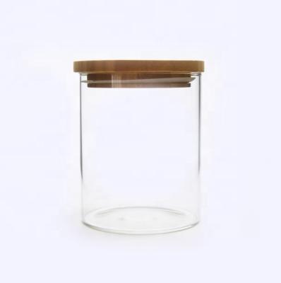 China 32oz Heat Resistant Glass Jar Heat Resistant Cylinder With Wooden Bamboo Lid For Food Coffee Tea Candy Storage for sale