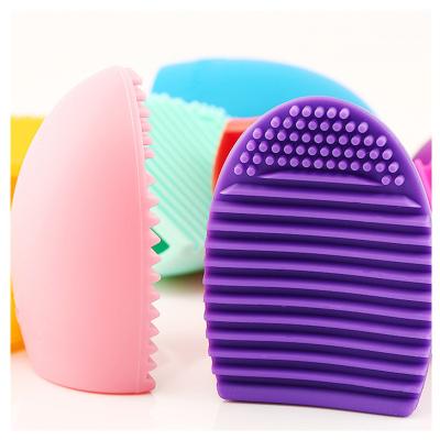 China Comfortable Handle Tool Makeup Brush Egg Silicone Brush Wholesale Cleaning Egg for sale