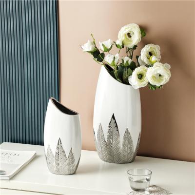 China Modern Minimalist Custom Logo Flower Vases Creative Silver Luxury Ceramic Vase For Wedding Decoration for sale