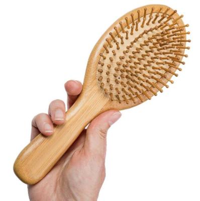 China Custom 100% Eco-Friendly Natural Wooden Paddle BAP Logo Massage Free Growth Hairbrush Prevent Hair Loss Bamboo Comb for sale