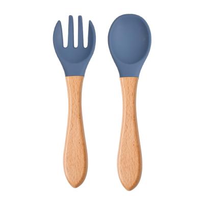 China Eco Candy Color Safety Stocked Baby Learning Feeding Spoon Fork Tool Baby Kids Children Boy Wooden Non-Slip Food Girl Soft Silicone Spoon for sale