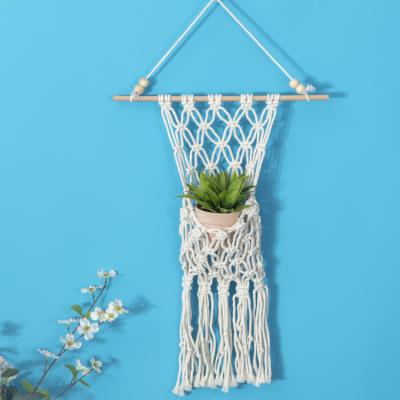 China Art Decor 2021 Handmade Warm Cotton Plant Macrame Bag Holder Custom Bohemian Wall Hangings for sale