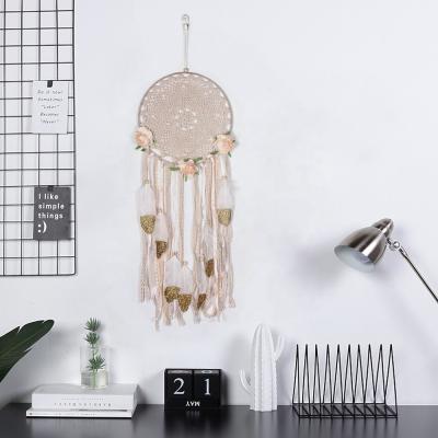 China 2022 Hot Selling Bohemian Craft Simple Dream Catcher Macrame Wall Hanging Home Decoration With Feather for sale