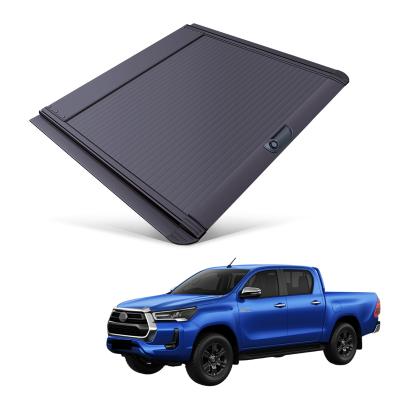 China Tailbox Car Parts Roll Cover Up Pick Up Truck Aluminum Alloy Tonneau Cover For Toyota Hilux 2015+ for sale