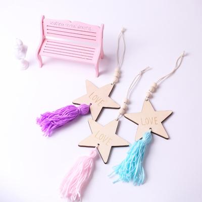 China Decor 2021 Decorators eco-friendly wooden tassel beads star shape home boho baby room nursery tent wall hanging decor for sale