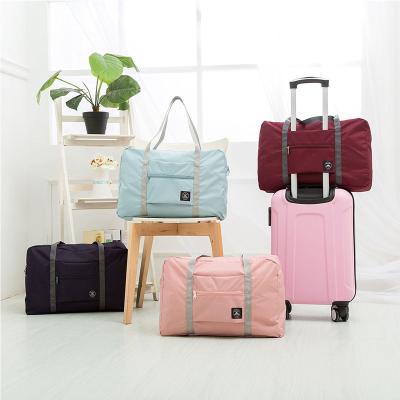 China Fashion Large Capacity Fashion Storage Bag Clothing Bag Organizing Travel Handbag Can Be Folded And Portable Outdoor for sale