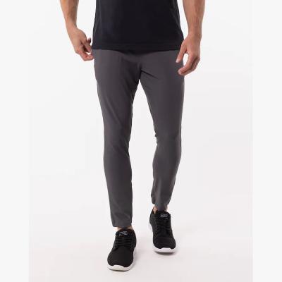 China Custom Logo Men Slim Fit Stretch Running Sports Jogger Jogger Jogger Jogger Pants Casual Pants with Zipper Pockets for sale