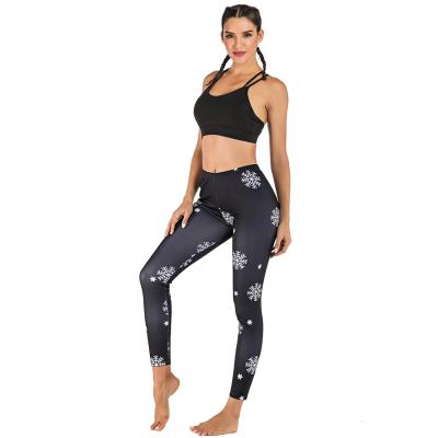 China Antibacterial Women Christmas Snow Printed Yoga Pants In Running Compression Workout Leggings for sale