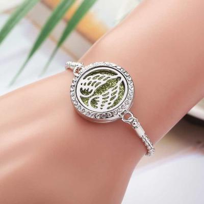 China FASHIONABLE Wholesale Faith Wing Aromatherapy Women OEM Essential Oil Fragrance Diffuser Stainless Steel Bracelet for sale