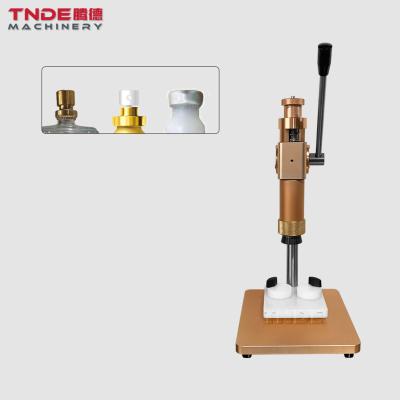 China Easy Operation TNDE Manual Blanking And Pressing Machine For Perfume Screw Neck And Collar for sale