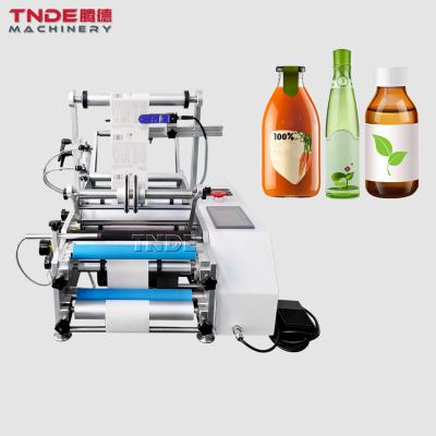 China TD-SRBLM semi automatic food labeling machine round bottle sticker labeling machines for sale