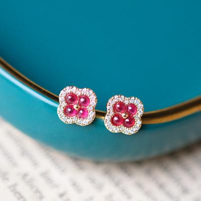 China Traditional Ruby Earrings Red Clover Shape Ear Studs with Real Diamonds and Solid Gold for sale