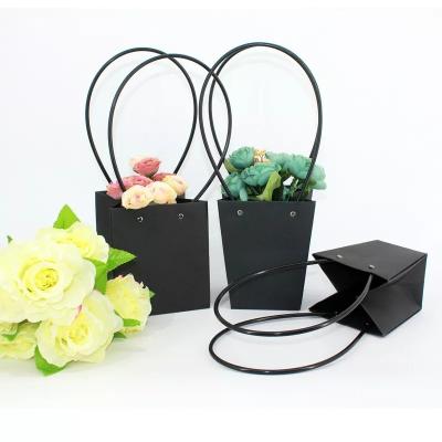 China Bolsas de papel impresas regalo de floristería bolsas de ramo impermeables con asas en venta